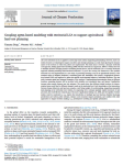 Coupling agent-based modeling with territorial LCA to support agricultural land-use planning